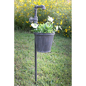 Faucet garden stake with potted flowers